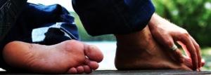 Picture of two feet and a hand
