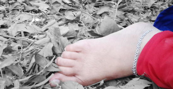Foot in dry leaves